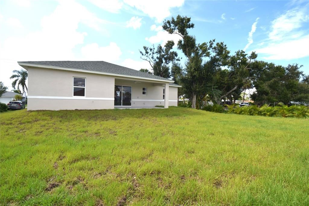 Back view of property and backyard