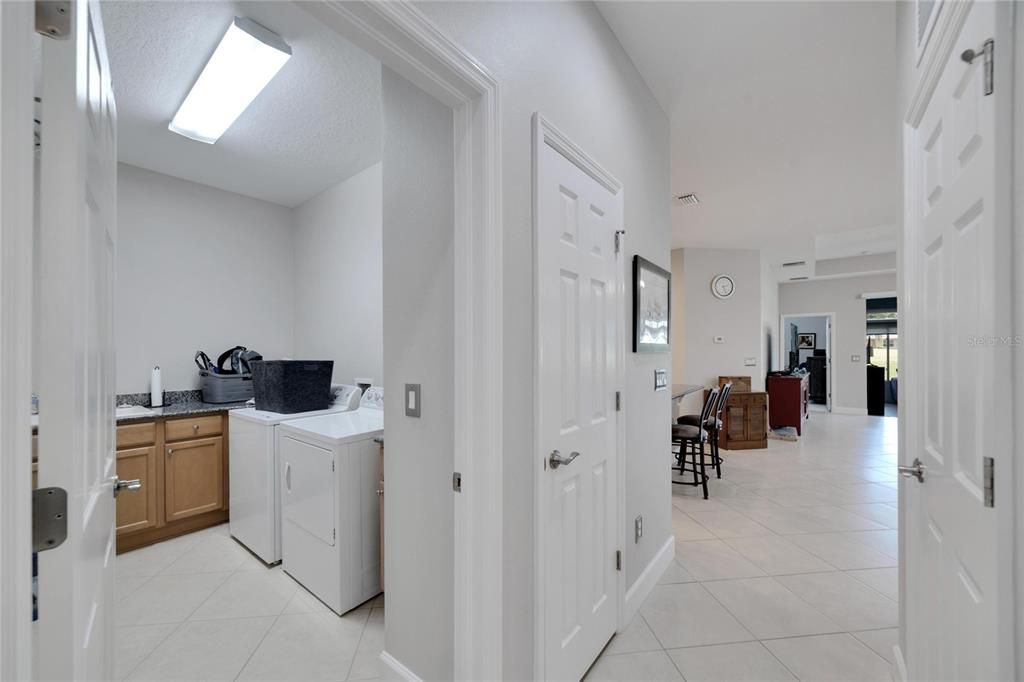 Separate laundry room with storage