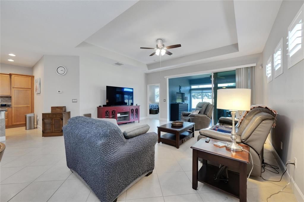 Spacious living room with tray ceilings