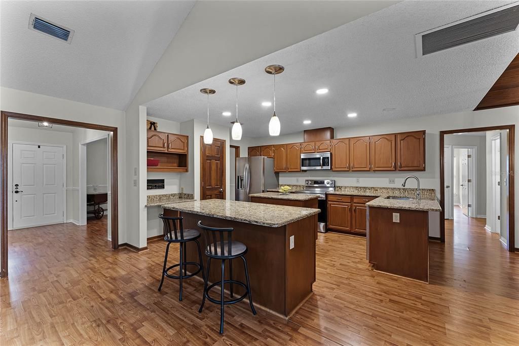 Kitchen with upgraded granite countertops and stainless steel appliances