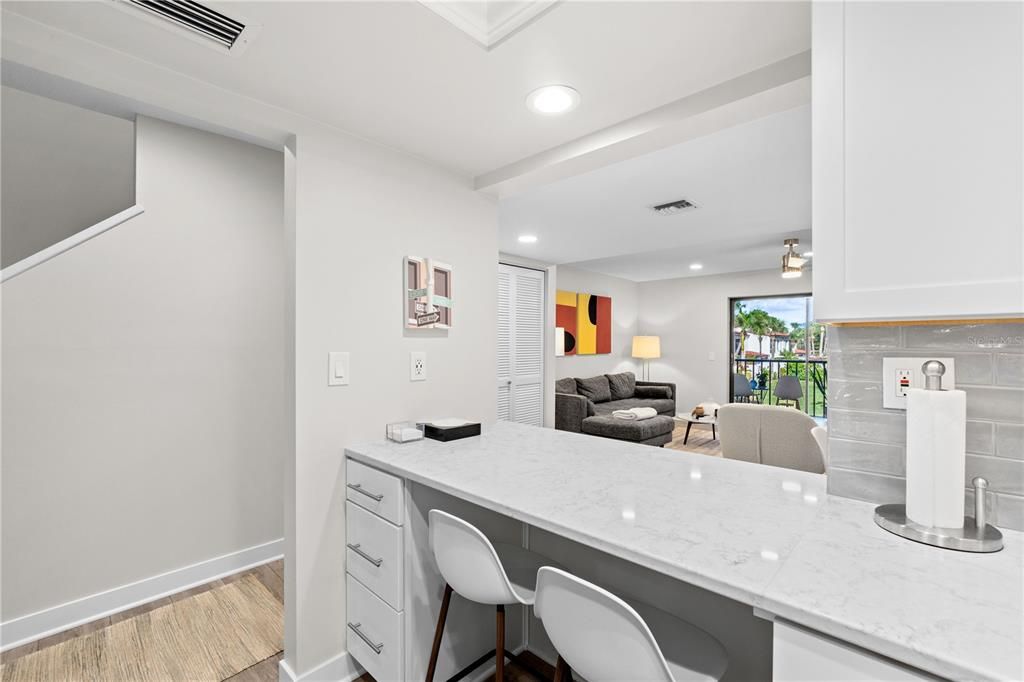 Counter height barstools on the kitchen side make a great spot for chatting while working on dinner or even just for working!