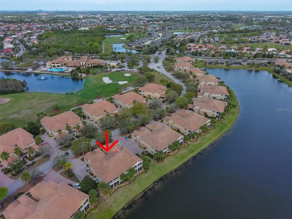 Aerial water view of condo and Renaissance Golf and Country Club. You are literally a 2 minute walk from the club.