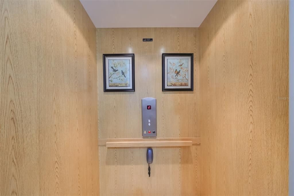 Private elevator leads up to the upstairs unit from the downstairs next to the garage. Ease and comfort are all of the features in this home.