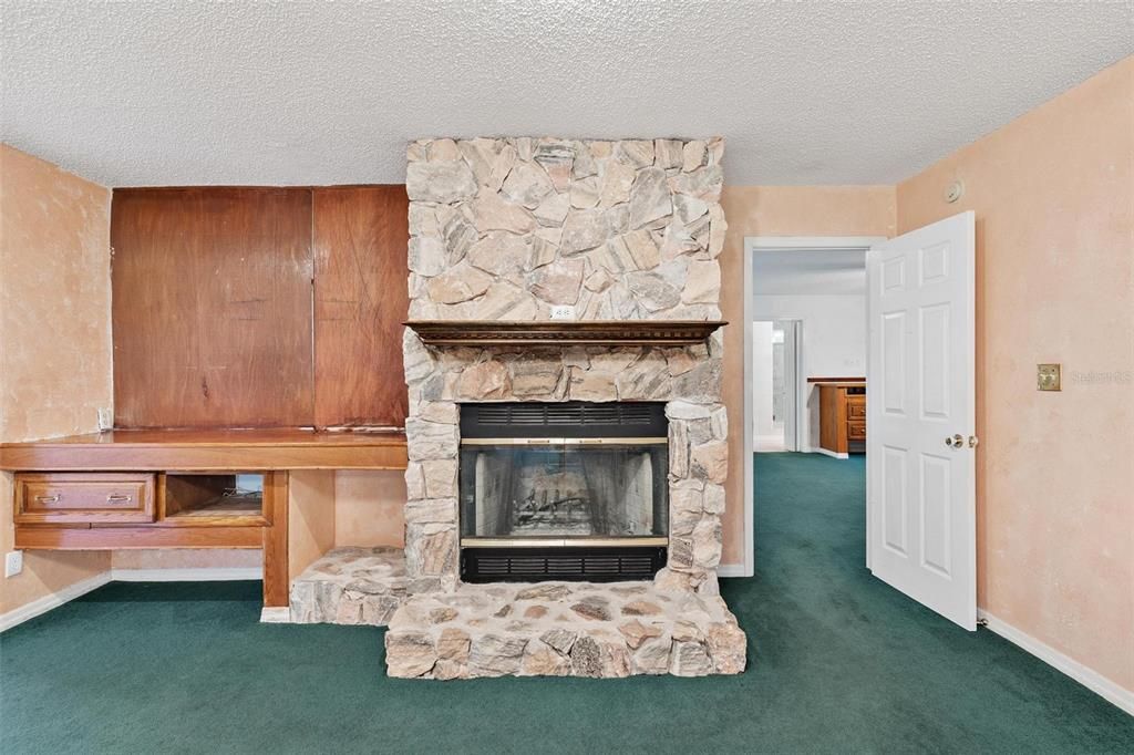 Living Area with Stone Wood-Burning Fireplace