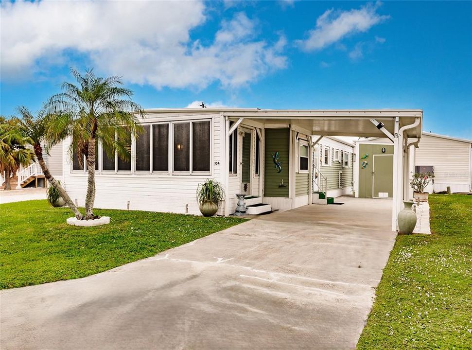 Exterior Front with covered parking and long driveway