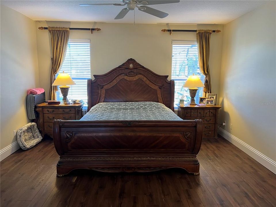 Primary bedroom with water views and Pool access