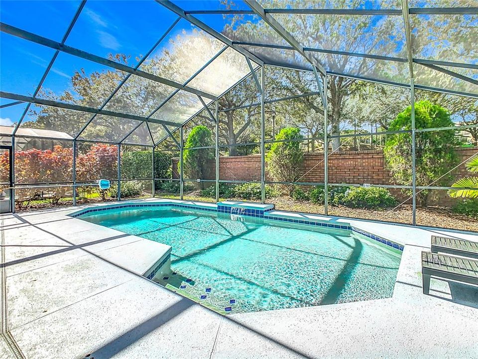 The brick wall provides privacy in the back yard.