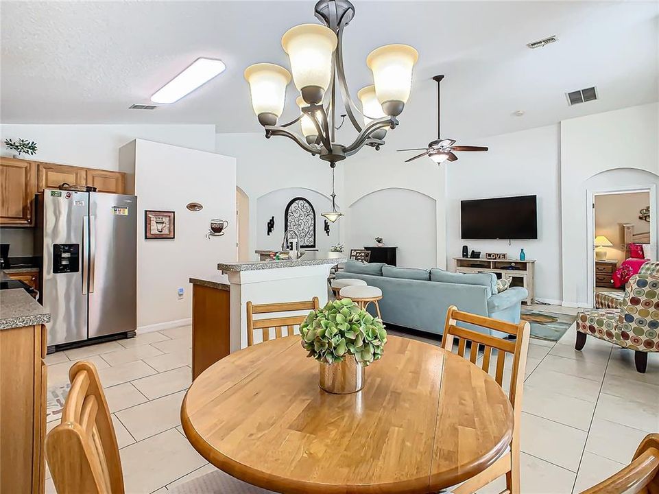 An eat-in space in the kitchen provides room for eating or playing games.