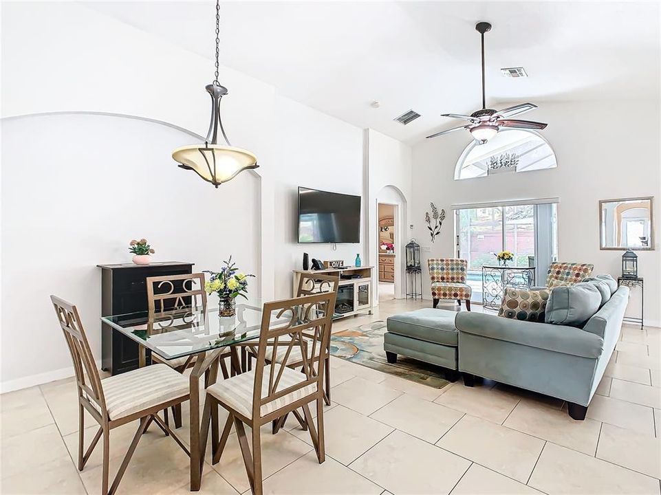 The open floor plan provides a living room and dining room with natural light shining throughout.