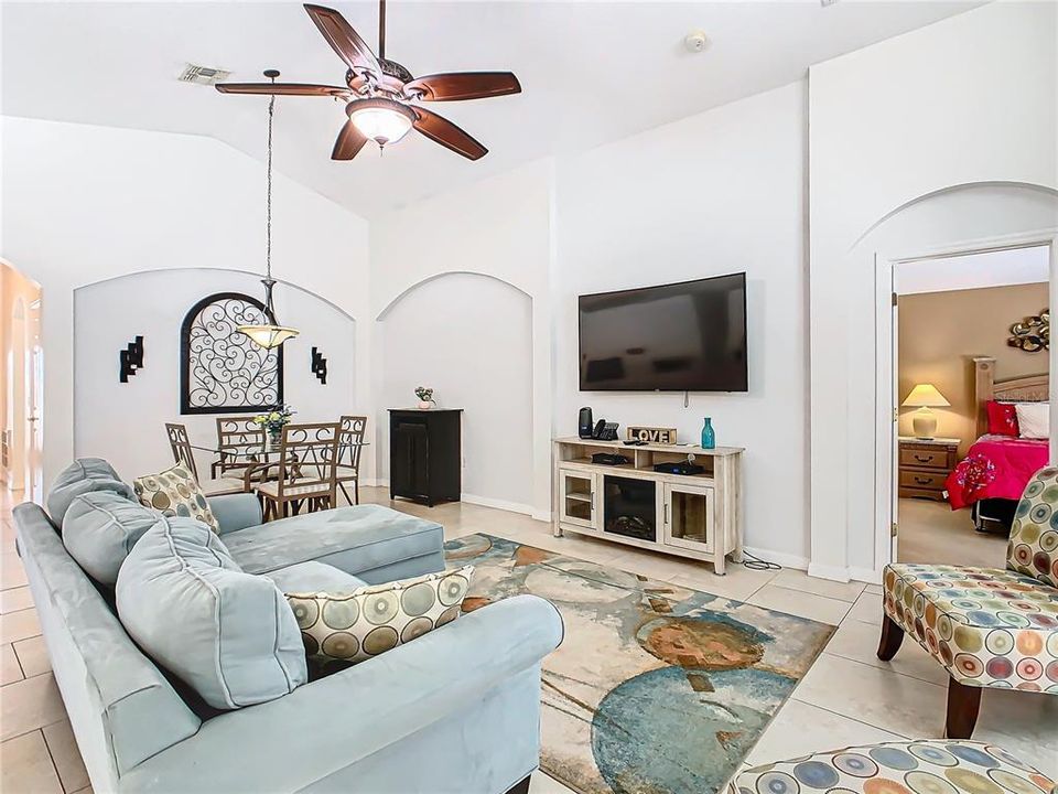 A view of the living room looking toward the primary suite.