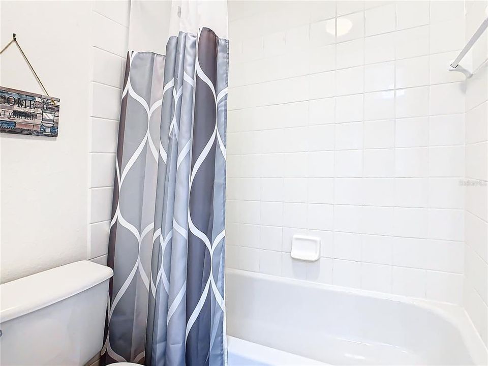 The shower and tub in the jack and jill bathroom.