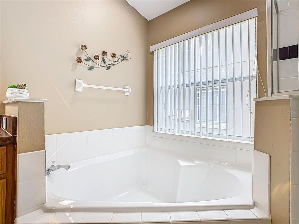 The garden tub is perfect for enjoying a bubble bath at the end of the day.