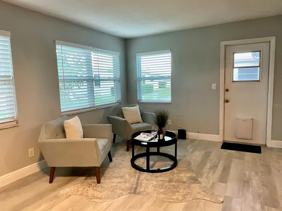 Family room with door to fenced patio