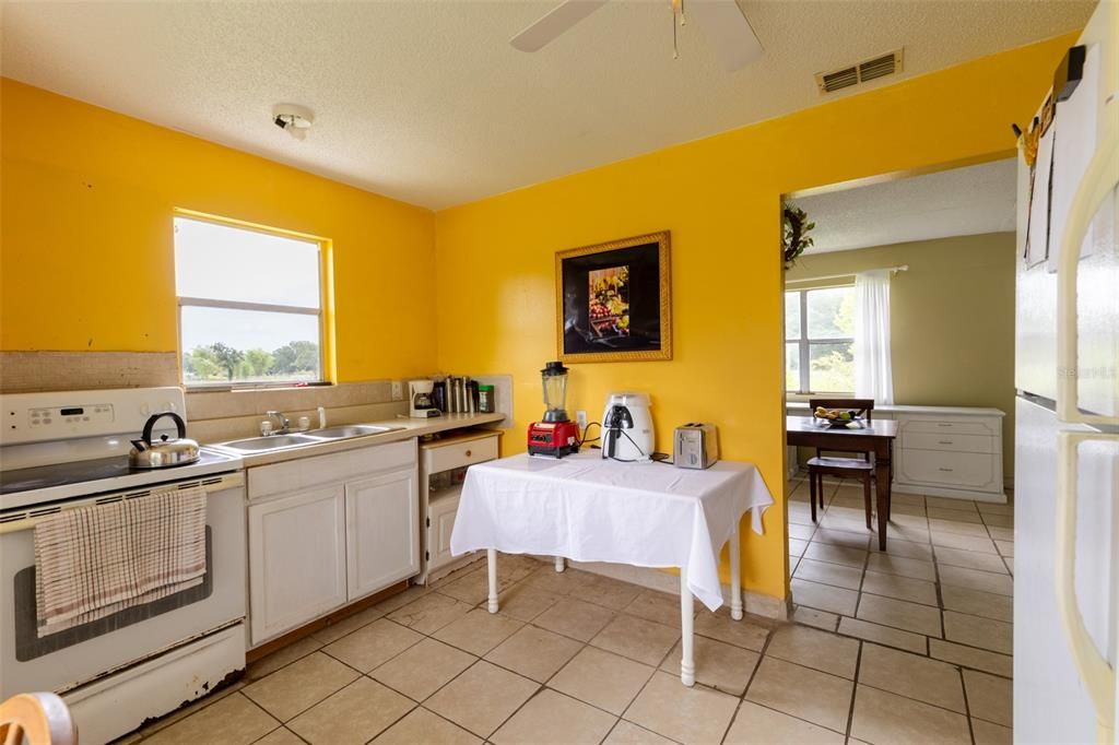 Kitchen with stove and refrigerator