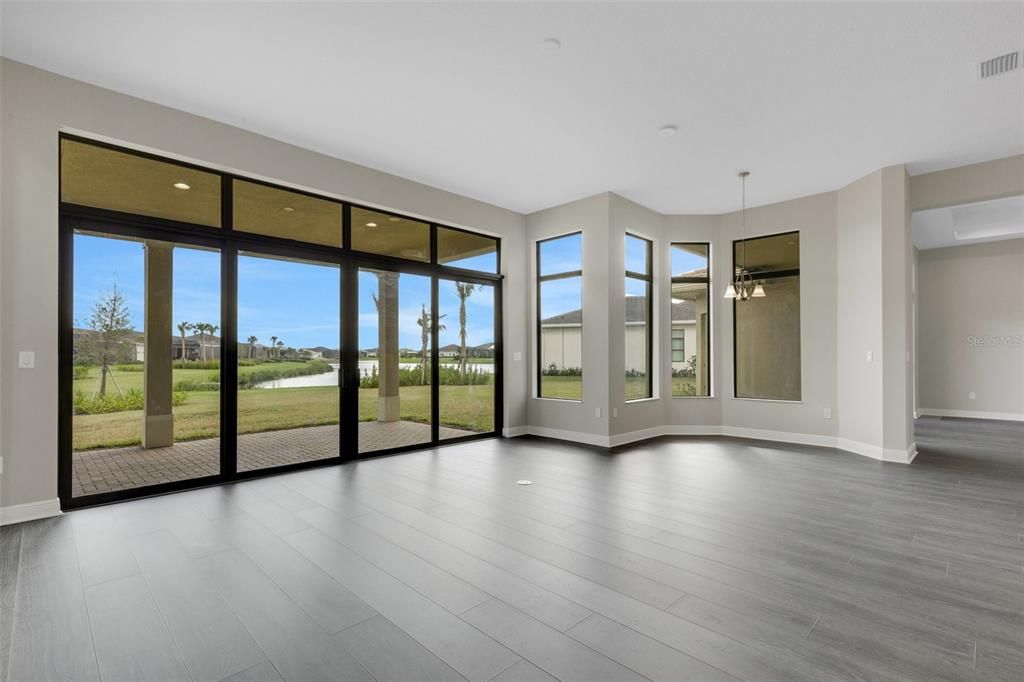 Family room with sliders leading out to the rear covered patio.