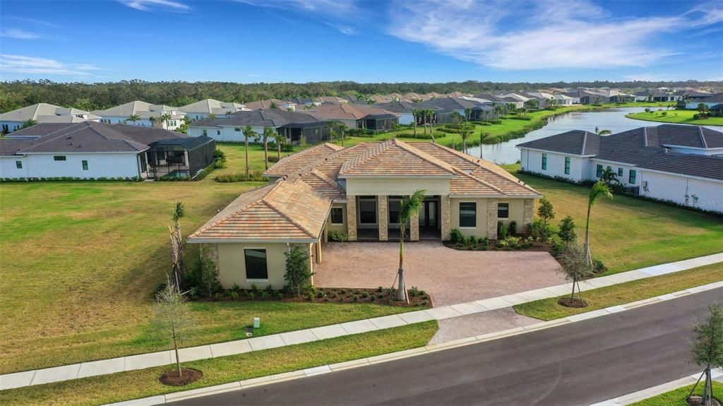 4+ car garage with side load entry and paver driveway.