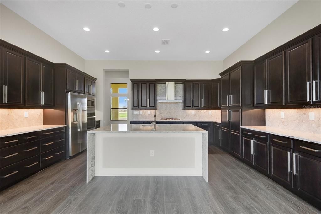 Lots of recessed lighting, cabinets and counter top space