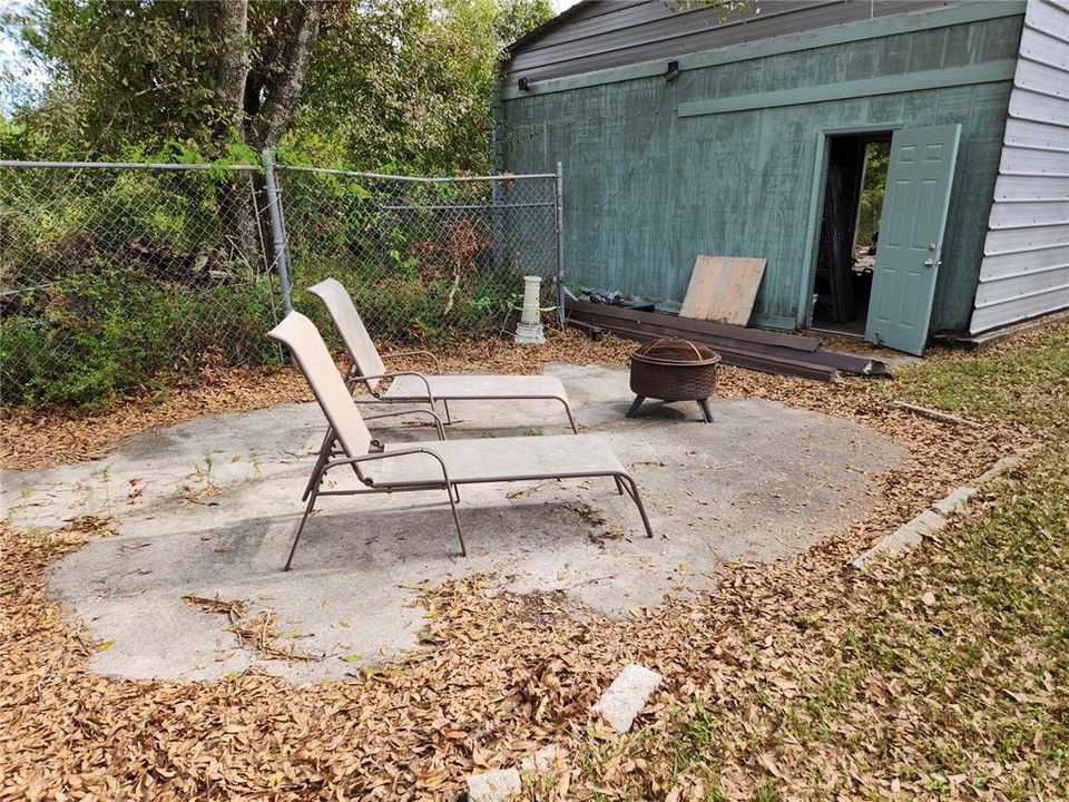 Patio behind outbuilding