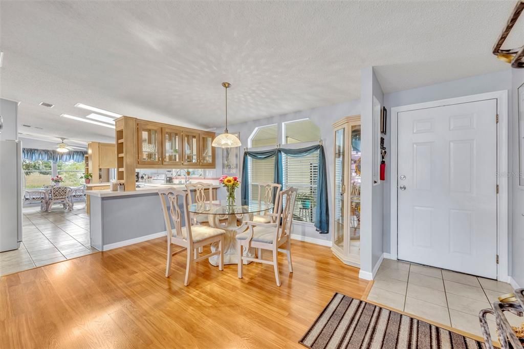 Front door entrance on the right and dining area.