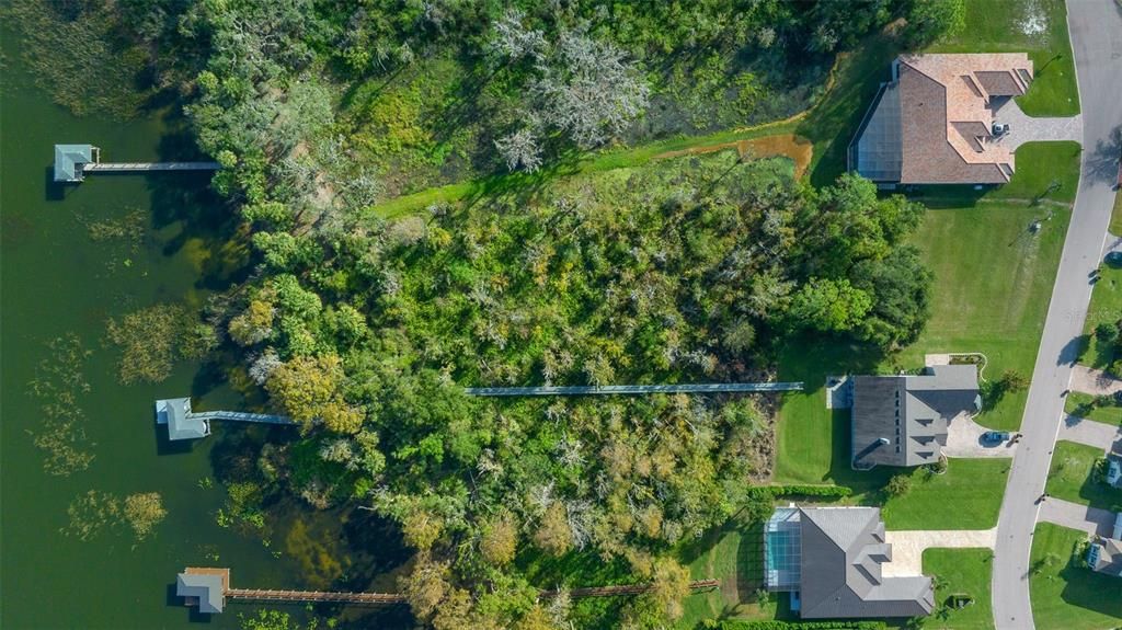 Clear your land or you can leave as is with a nature trail to your boat dock.