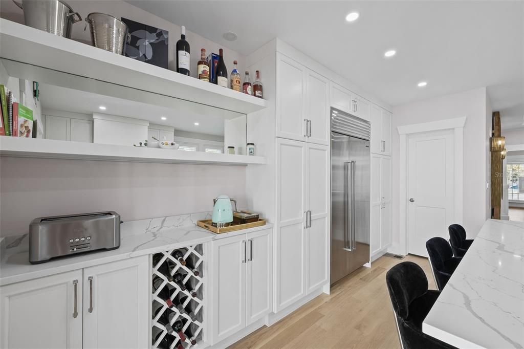 Lots and lots of storage with pantry cabinets on either side of SubZero Fridge