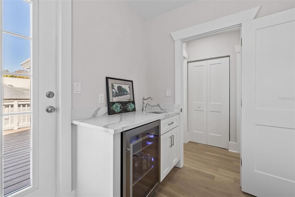 Beverage fridge and wet bar. It also has a door that goes to an outside balcony - VERY COOL!