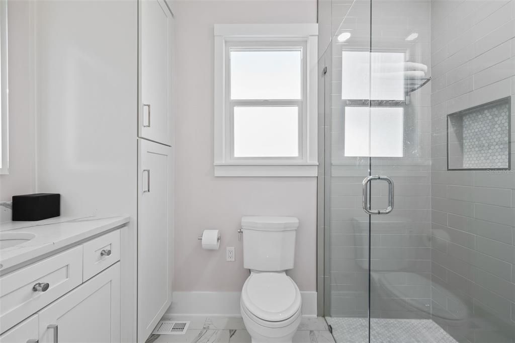 Guest bath with large walk in shower.