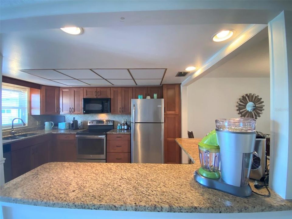 Step in through the front door to stone counter in Kitchen