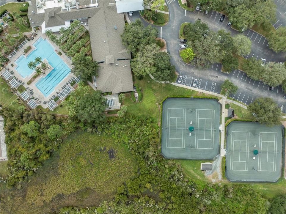 Amenity center with clubhouse, tennis courts, pickleball courts, pool and more!