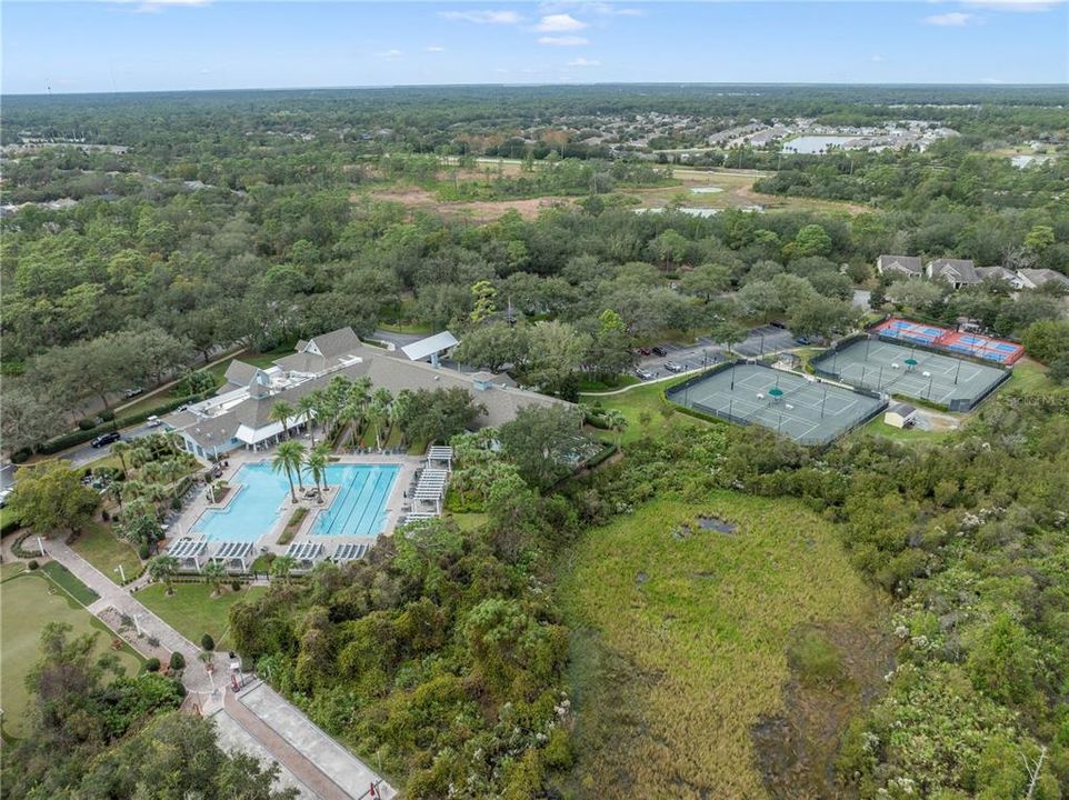 Amenity center with clubhouse, tennis courts, pickleball courts, pool and more!