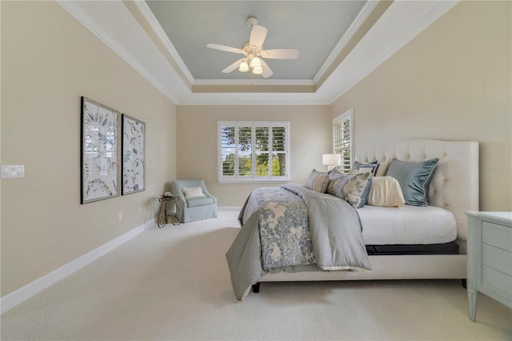 Primary bedroom situated at the rear of the home with views of the water