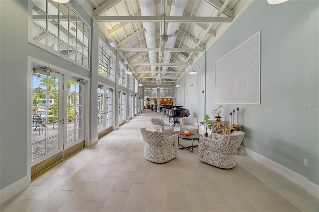 View of main lobby of clubhouse with on site restaurant in the background