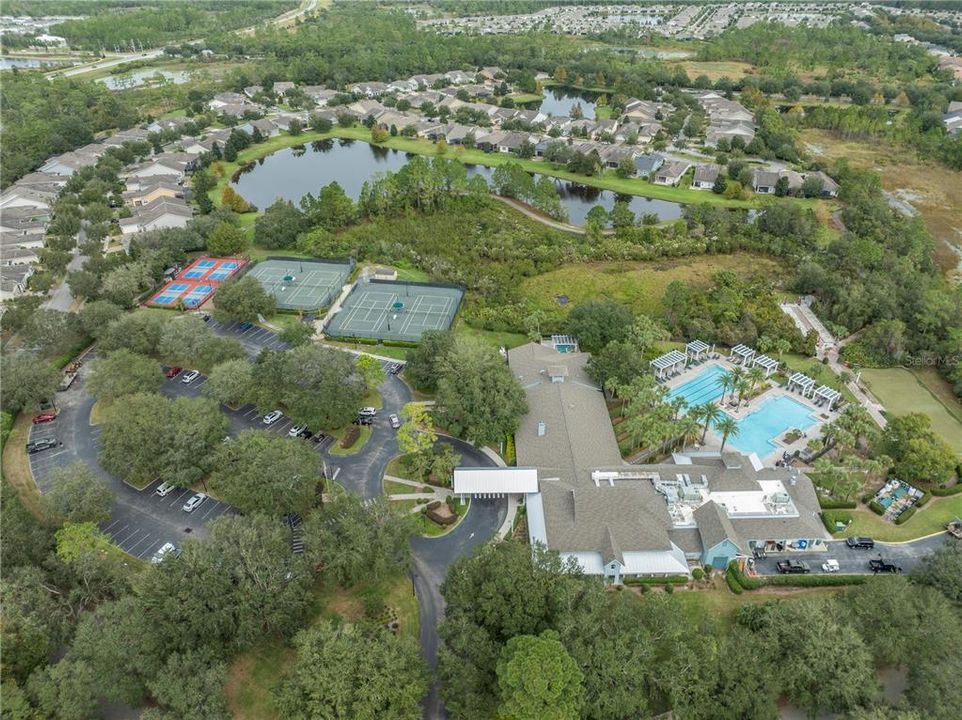 Amenity center with clubhouse, tennis courts, pickleball courts, pool and more!