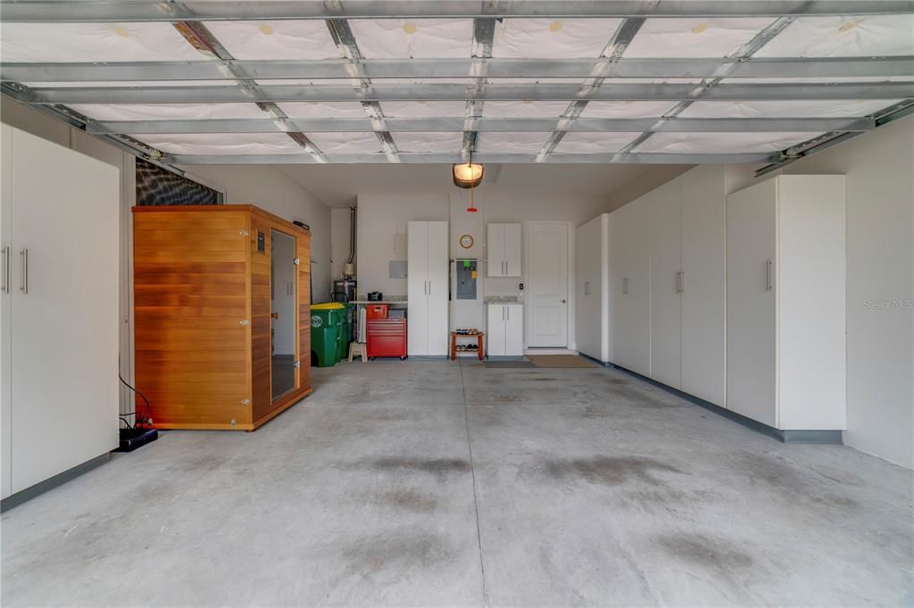 Garage with a ton of storage cabinets