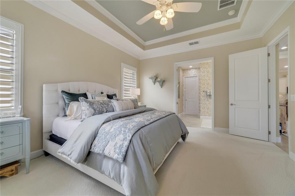 Primary bedroom situated at the rear of the home with views of the water