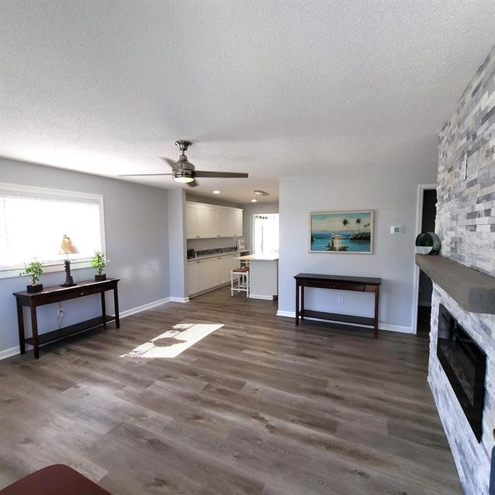 Step into the 14X15 Living Room and notice the beautiful luxury plank flooring and neutral wall colors.