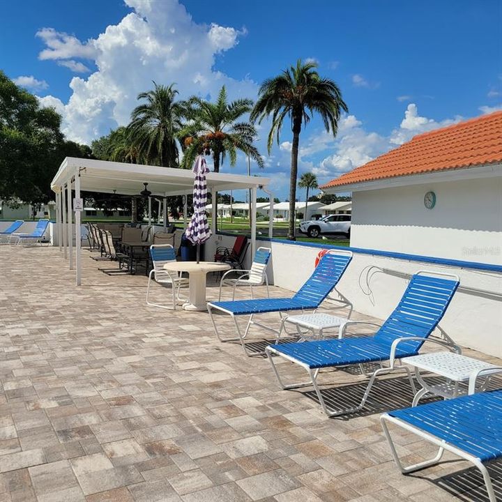 This is one section of the available lounge chairs to be enjoyed. Notice there are table and chairs in the shade as well.