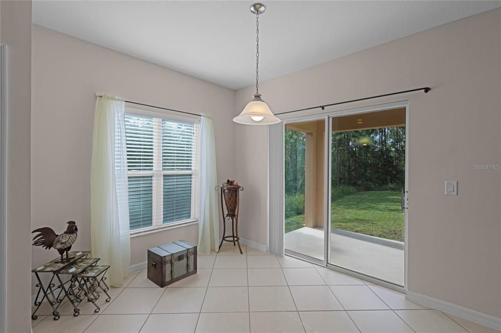 Breakfast nook with sliding doors out to covered patio