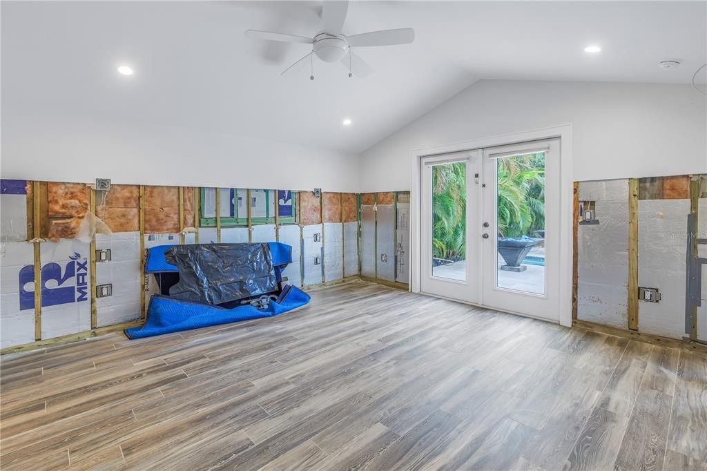 Master bedroom with doors out to back patio, pool/spa