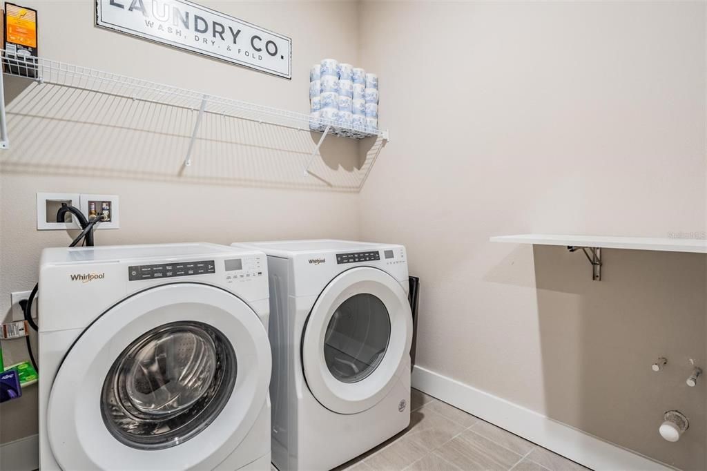 Large Laundry Room with wall mounted ironing board