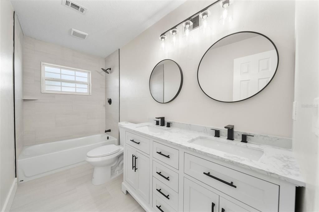 Bathroom 3 with Double Sinks + Tub