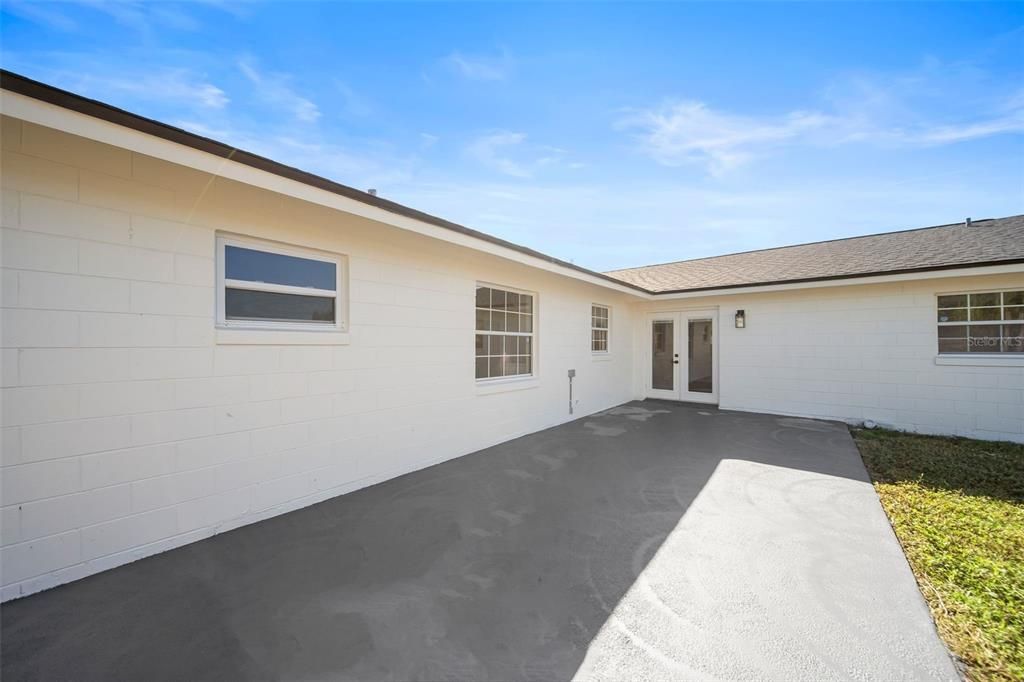 Back Patio with Partially Fenced in Yard