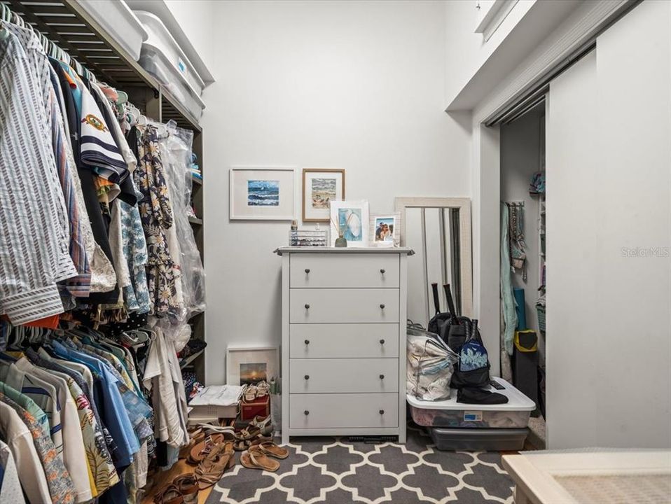 Primary bedroom walk-in closet