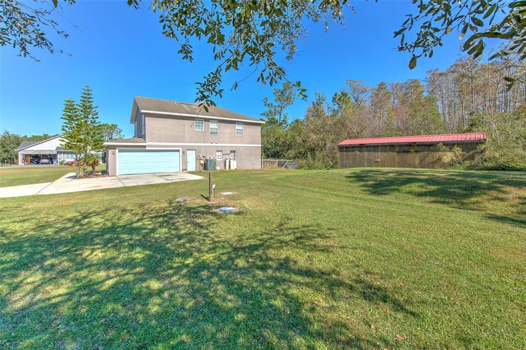 View of garage, huge shed & side yard