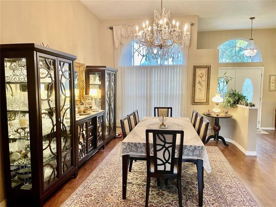 Living Room featuring beautiful CHANDELIER that conveys