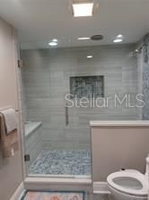 master bathroom with beautiful glass shower stall