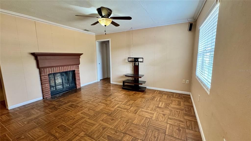 Living Room w/ Wood Burning Fireplace