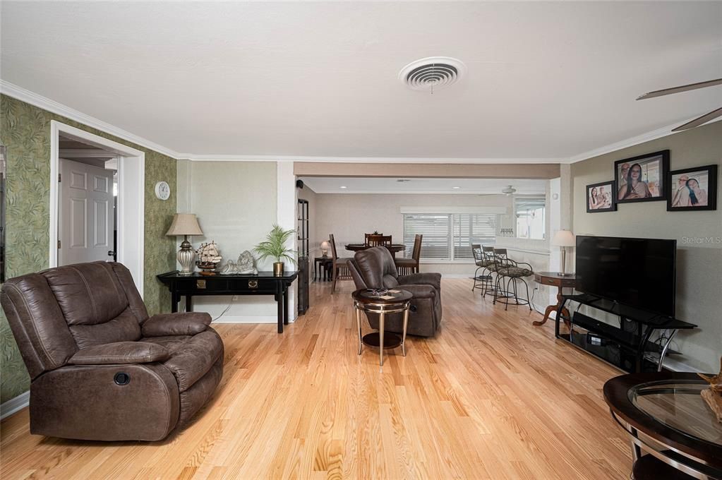 Living Room with Shiny OAK FLOORING Looking Towards Kitchen & Dining Room