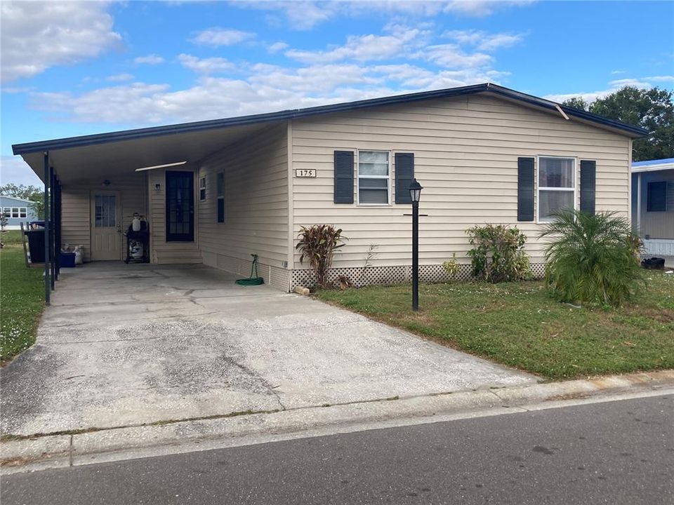 Carport with storage shed/workshop