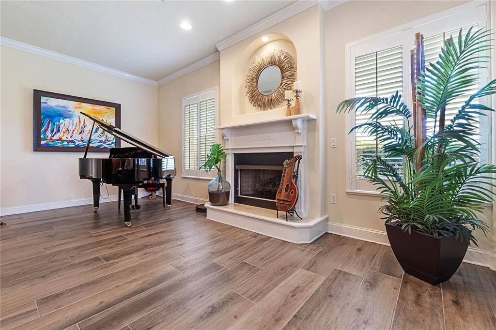 Piano Room, right off of Family Room w/Gas Fireplace & Windows w/Plantation Shutters